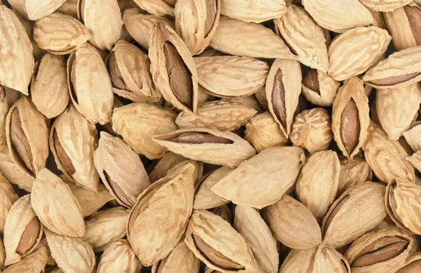 Background Big Dried Peeled Almonds Situated Arbitrarily — Stock Photo, Image