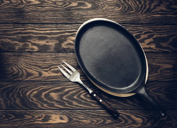 Fork Cast Iron Pan Lie Wooden Table Space Text Stylized — Stock Photo, Image