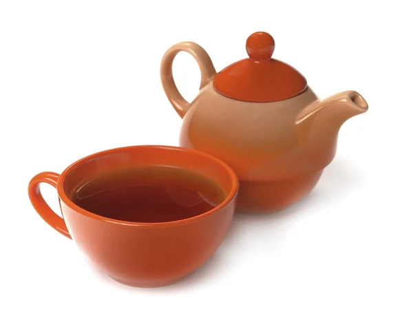 Oranžový hrnek čaje a konvice — Stock fotografie