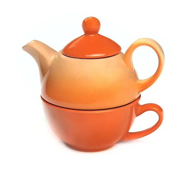 Teapot on the teacup on a white background — Stock Photo, Image