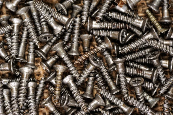 Pile of screws on the matting — Stock Photo, Image
