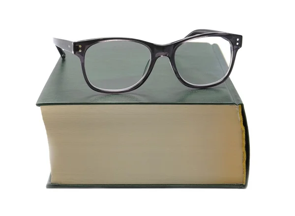 Glasses lie on the book — Stock Photo, Image