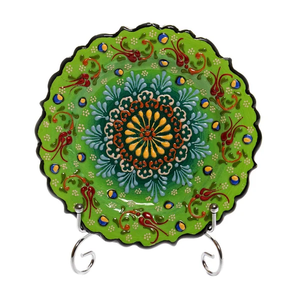 Gröna dekorativa keramiska tallrik med blommönster — Stockfoto