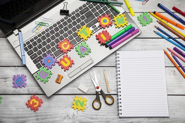 Laptop with letters and office or student gear. — Stock Photo, Image