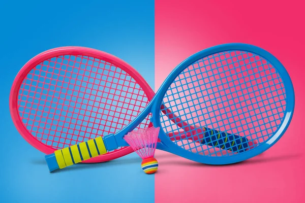 Badminton concept.Racket and shuttlecock.Badminton racket and colorful shuttlecock with colorful cap.