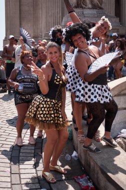 Revellers in costumes take over the streets of the city center in Rio's largest carnival