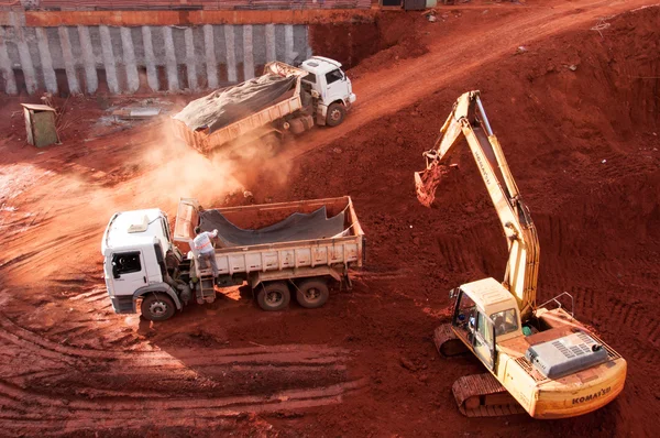 Excavator loading dumper truck tipper