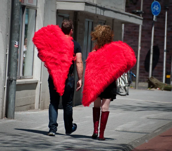 Couple with half heart shaped costumes
