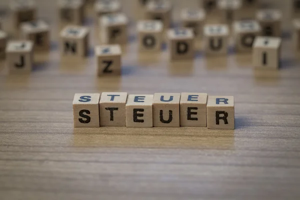 Steuer written in wooden cubes — Stock Photo, Image