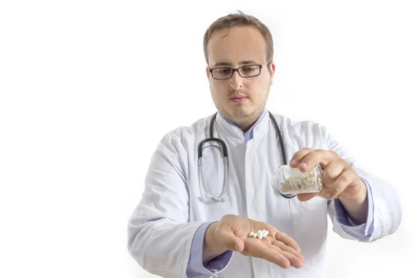 Joven Doctor con botella de píldoras — Foto de Stock