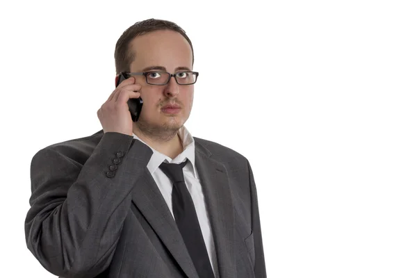 Jeune homme d'affaires en costume avec téléphone portable — Photo