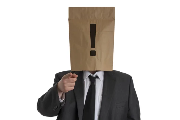 Man with Paper Bag with exclamation mark on his head pointing in — Stock Photo, Image