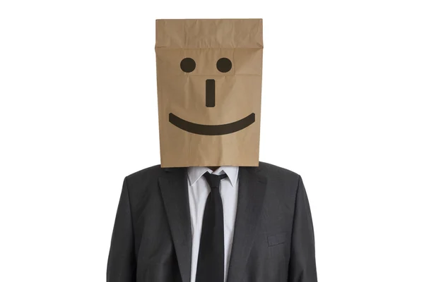 Homme avec un sac en papier avec un sourire sur la tête — Photo