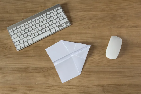 Paper Plane on an office desk — Stock Photo, Image