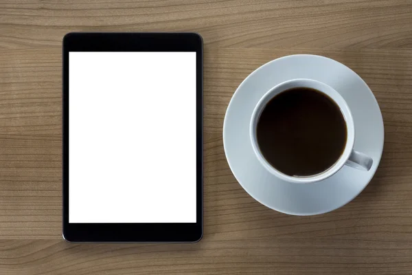 Tablet computer and cup of coffee — Stock Photo, Image