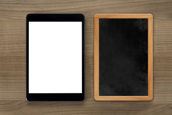 Tablet computer and vintage chalkboard — Stock Photo, Image