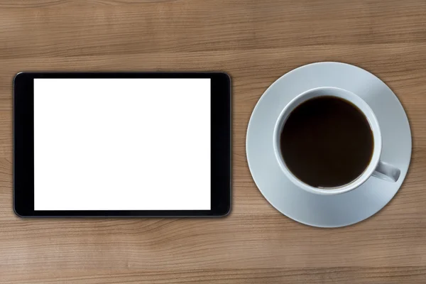 Tablet computer and cup of coffee — Stock Photo, Image