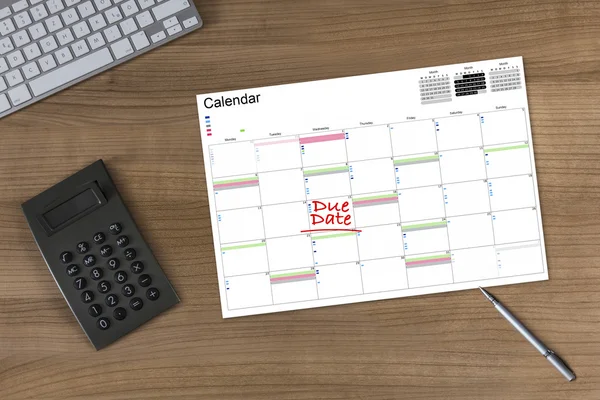 Kalender vervaldatum en Calculator op houten tafel — Stockfoto