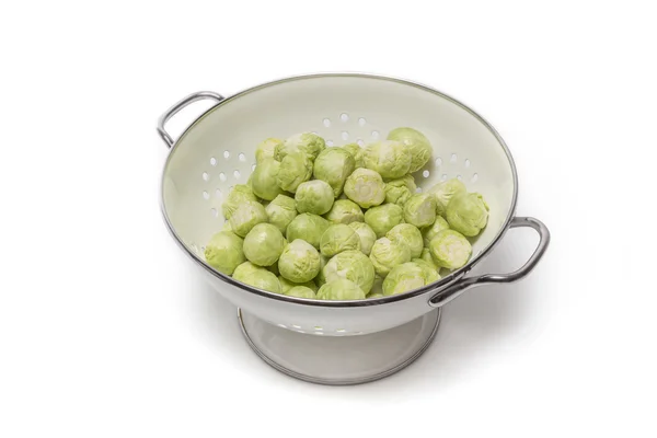 Brussels sprouts in a sieve — Stok fotoğraf