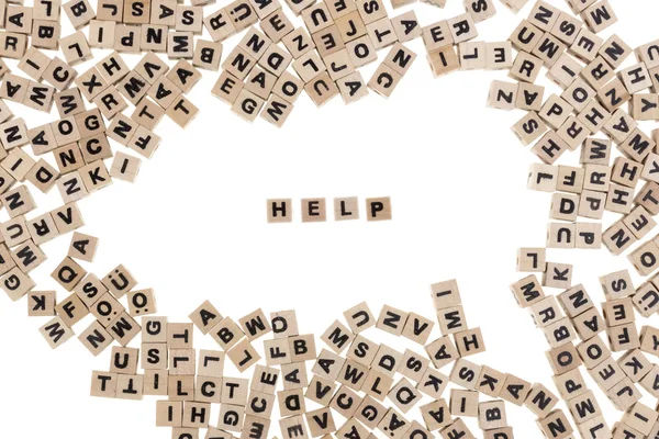 Help written in small wooden cubes — Stock Photo, Image