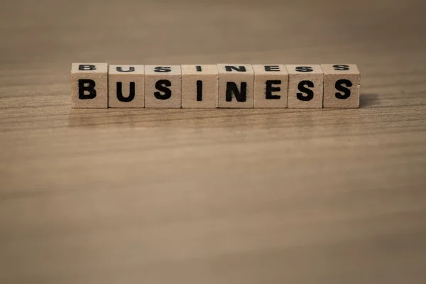 Business in wooden cubes — Stock Photo, Image