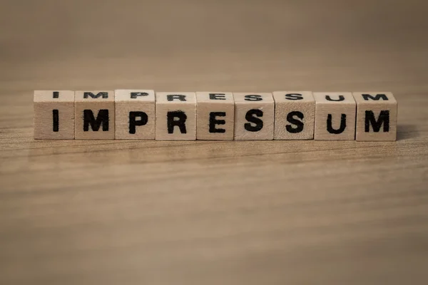 Impressum in wooden cubes — Stock Photo, Image