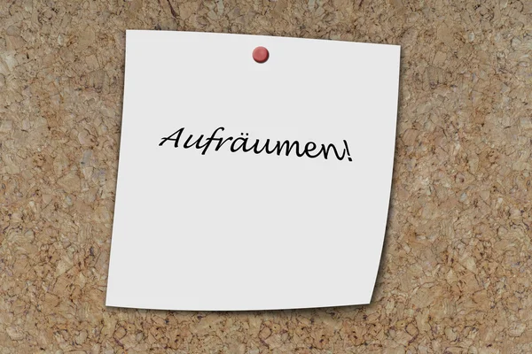 Aufraumen written on a memo — Stock Photo, Image