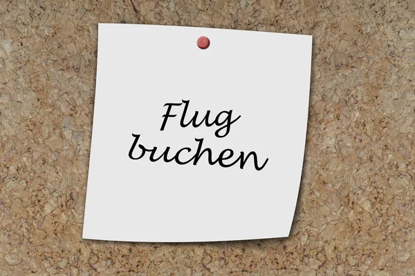 Flug buchen scritto su un promemoria — Foto Stock