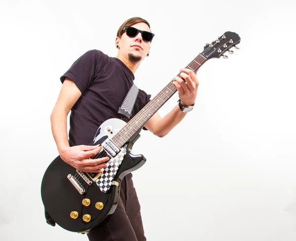 Young rockstar playing on guitar — Stock Photo, Image