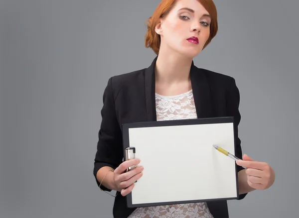 Businesswoman with white sheet of paper — Stock Photo, Image