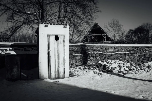 Old toilet in rural scenery on the village