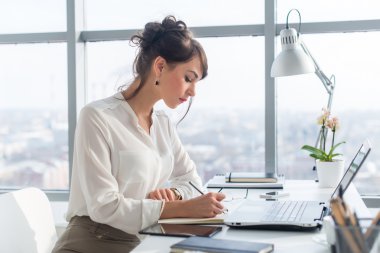 Young woman working as an office manager 