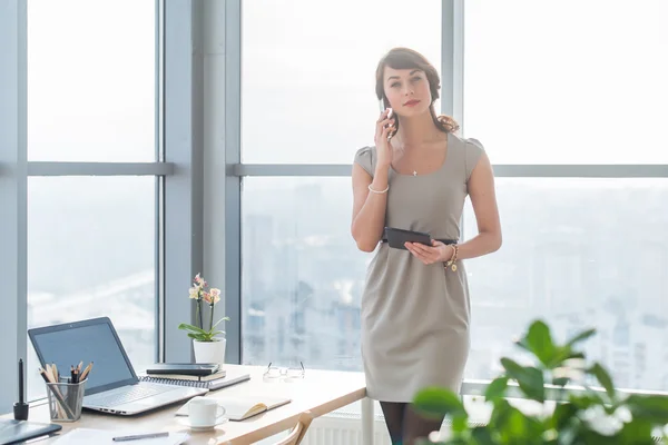 Young female consultant having business call — 图库照片