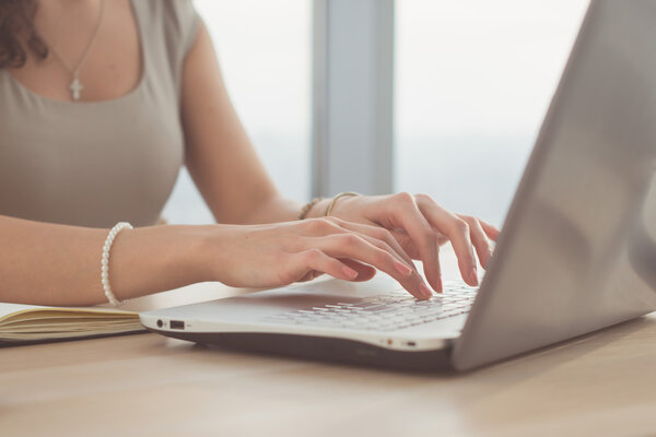 woman using laptop, teleworking