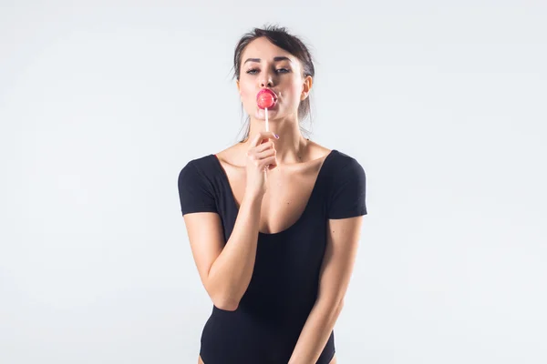 Young brunette model with lollipop — Stock Photo, Image