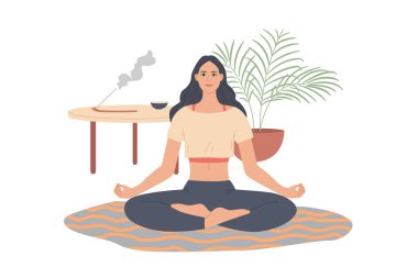 Evde yoga pozu veren bir kadın. Kız oturma odasında meditasyon yapıyor.