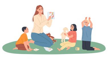 Anaokulu öğretmeni çocuklarla oynuyor, onlara harflerle resimler gösteriyor..