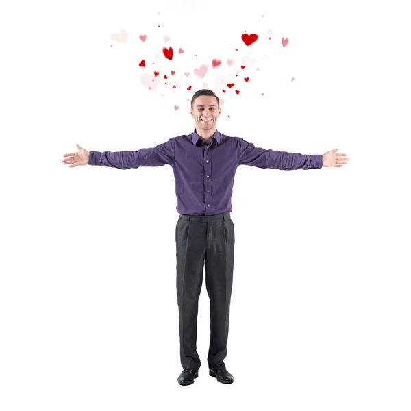 Lovely young man declaration of love welcoming you white background with flying hearts around hands sides — Stock Photo, Image