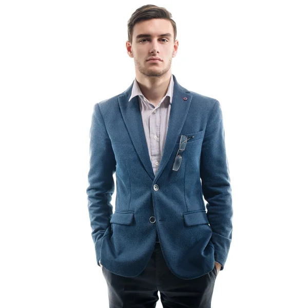 Young handsome guy standing alone with his hands pockets — Stock Photo, Image