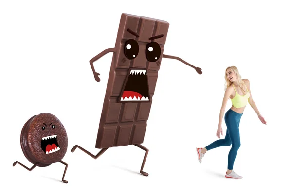 Söt flicka på en diet styr sin vikt. Begreppet körs bort från frestelser som choklad och godis. — Stockfoto