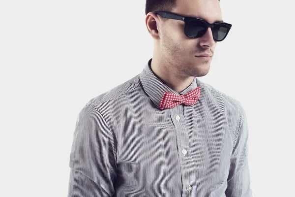 Young man hipster  with bow tie sunglasses confident certained, serious look. — Stock Photo, Image