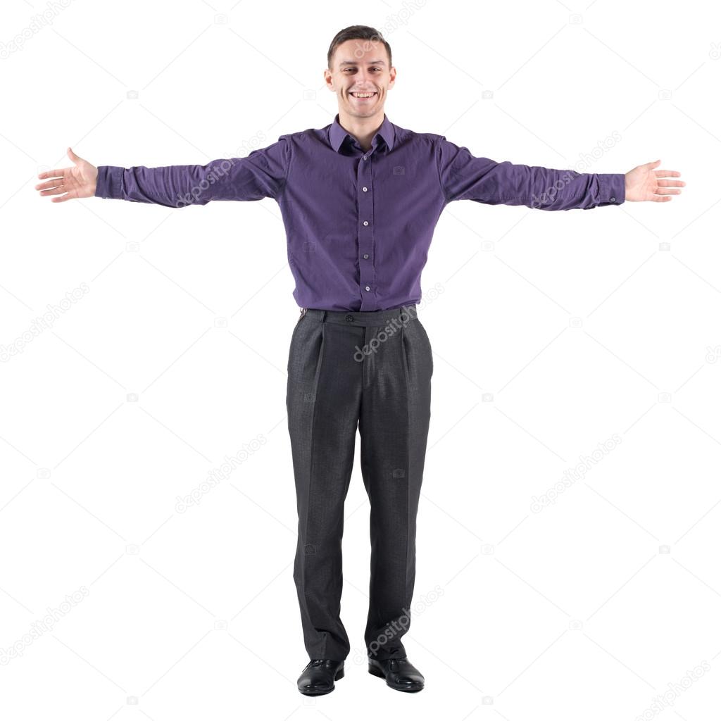 young casual man welcoming you white background with hands on the sides