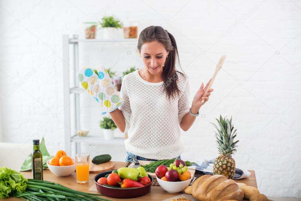 Woman preparing dinner in a kitchen concept cooking, culinary, healthy lifestyle.