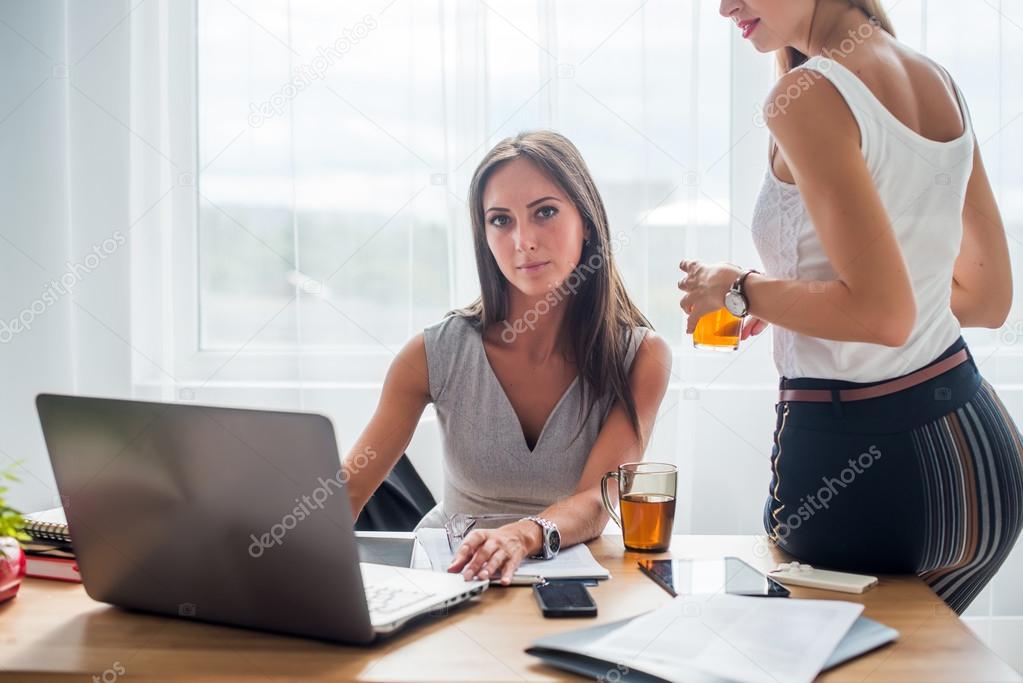 Young businesswoman sitting at desk