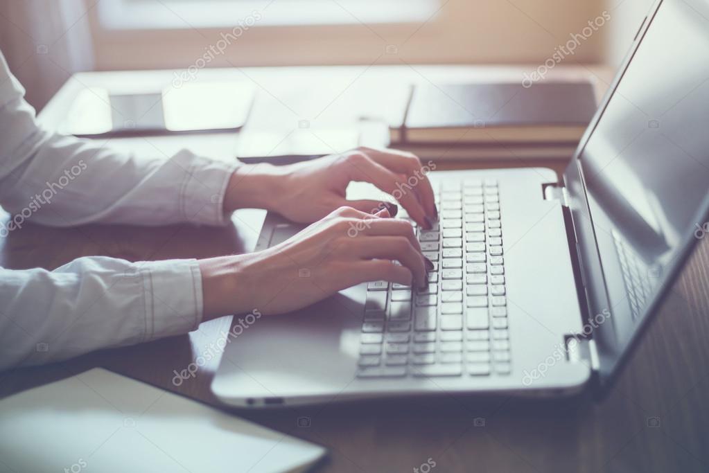 Woman working in home office hand