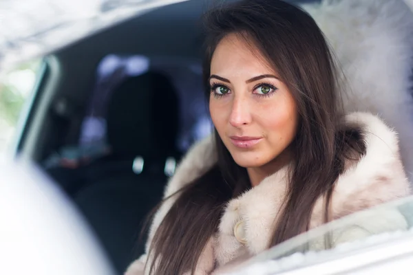 Woman car driver in fur coat. — Stock Photo, Image