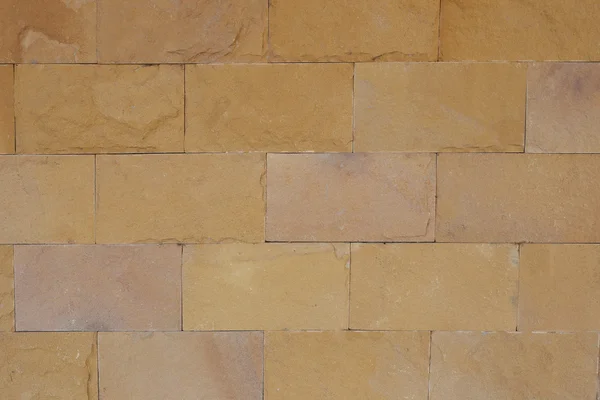 Bruine stenen muur voor achtergrondontwerp. — Stockfoto