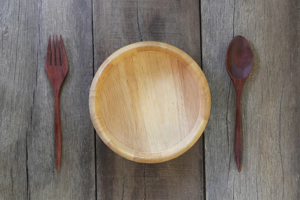 Lepel, vork en houten kom. — Stockfoto