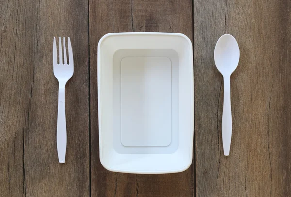 Witte plastic kom en lepel, vork. — Stockfoto