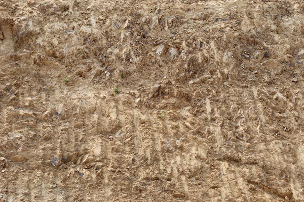 Bruin textuur van de bodem en zijn ruwe. — Stockfoto